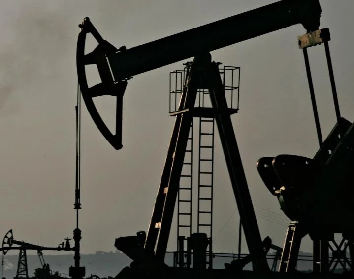 Oil pumpjack silhouetted against the sky